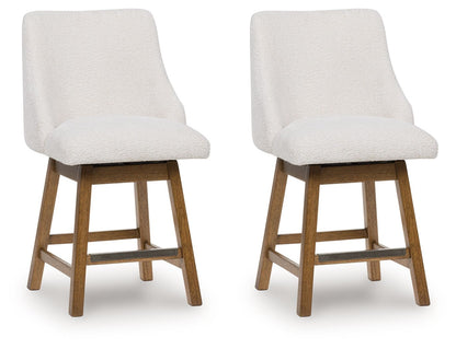 Cabalynn - Oatmeal / Light Brown - Upholstered Swivel Barstool (Set of 2)